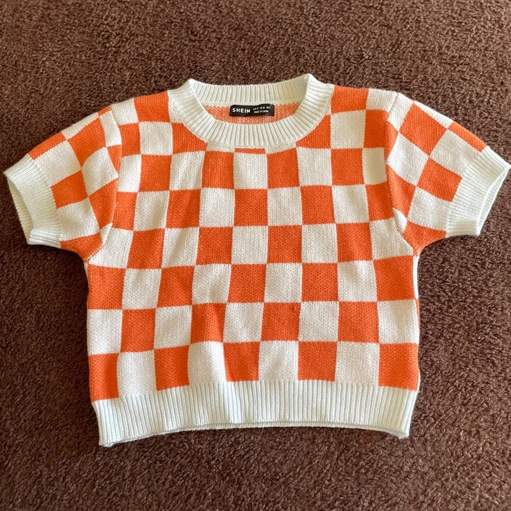Orange and white checkered top